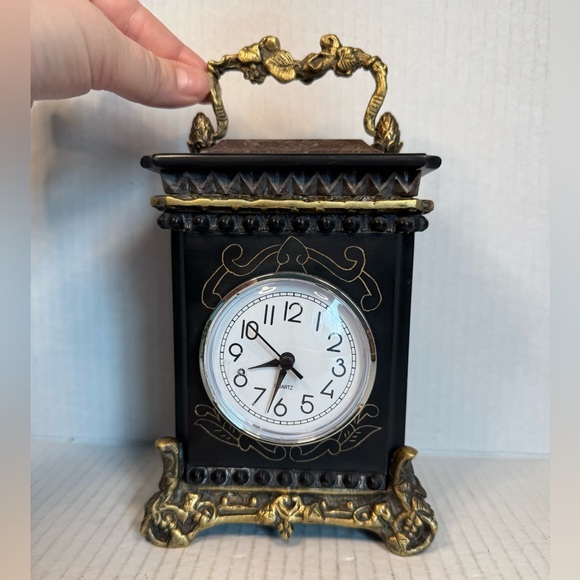 Antique Quartz clock made of marble and metal.